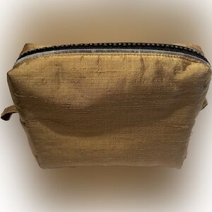 Candice Sormani Handcrafted Make-up bag. Gold colour.